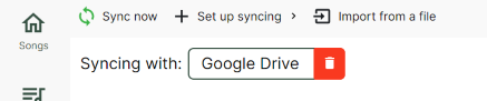 Screenshot showing the text “Syncing with” and a box with Google Drive in it. A red delete button is on the right of the box, allowing for the removal of syncing with that service